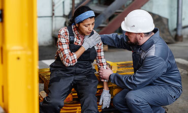 Injured factory worker receiving help – legal services for workplace injury claims